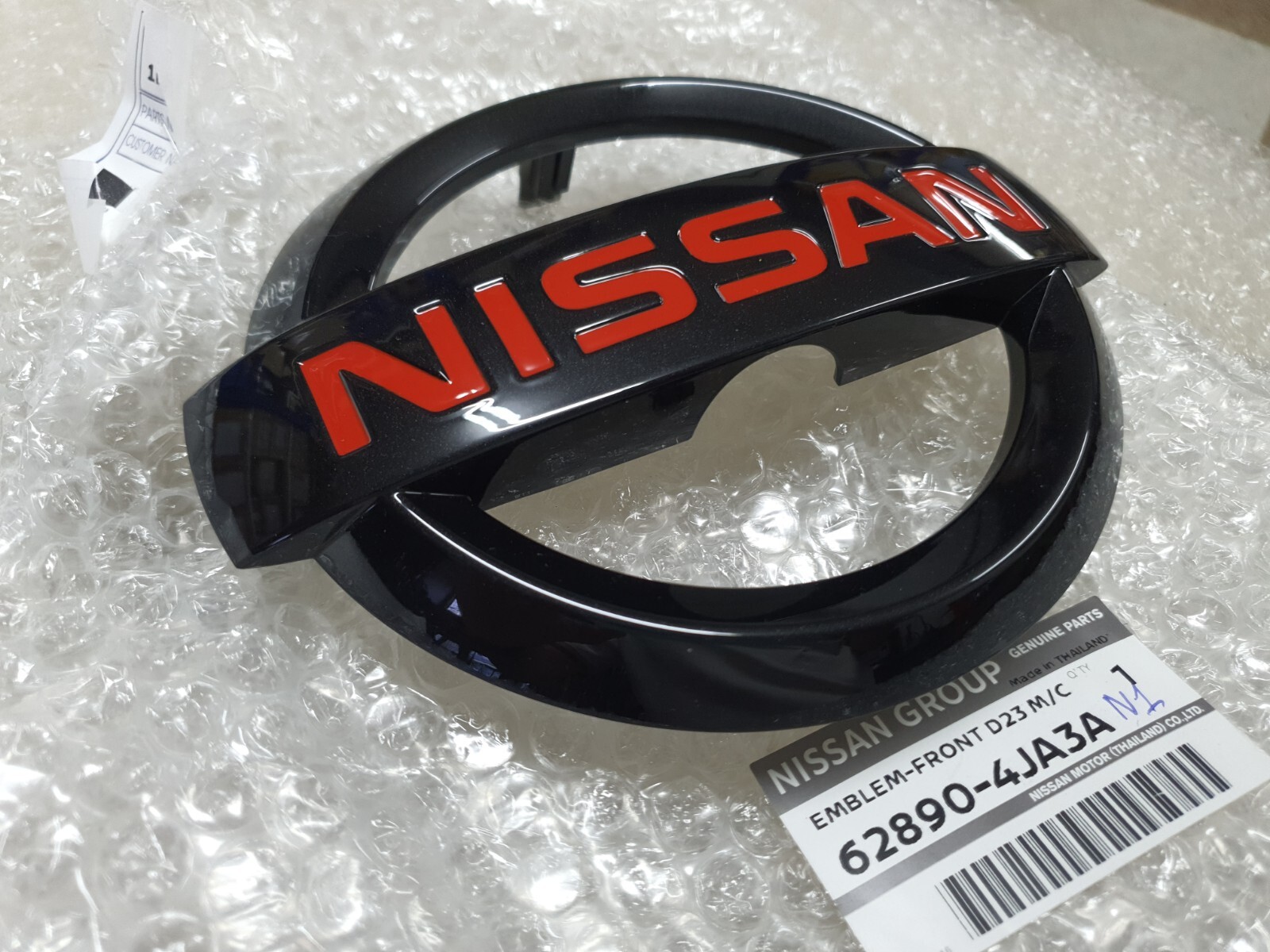 1X OEM FRONT GRILLE BLACK LOGO EMBLEM FOR NAVARA NP300 D23 M/C 2022